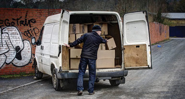 Suspicious character unloading boxes from an unmarked van